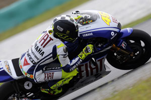 Note the Monster logo on Rossi's helmet