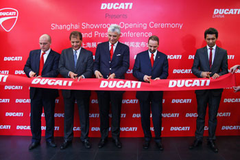 Ducati executives cut the ribbon to launch the Shanghai store.