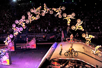 Pastrana pulls a double backflip with Cam Sinclair watching on at Nitro Circus Live in Melbourne on Saturday night.