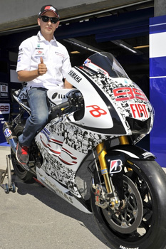 Lorenzo's bike features faces of Fiat Yamaha fans from around the globe.