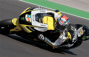 Colin Edwards has re-signed with Yamaha to remain in MotoGP for 2011.